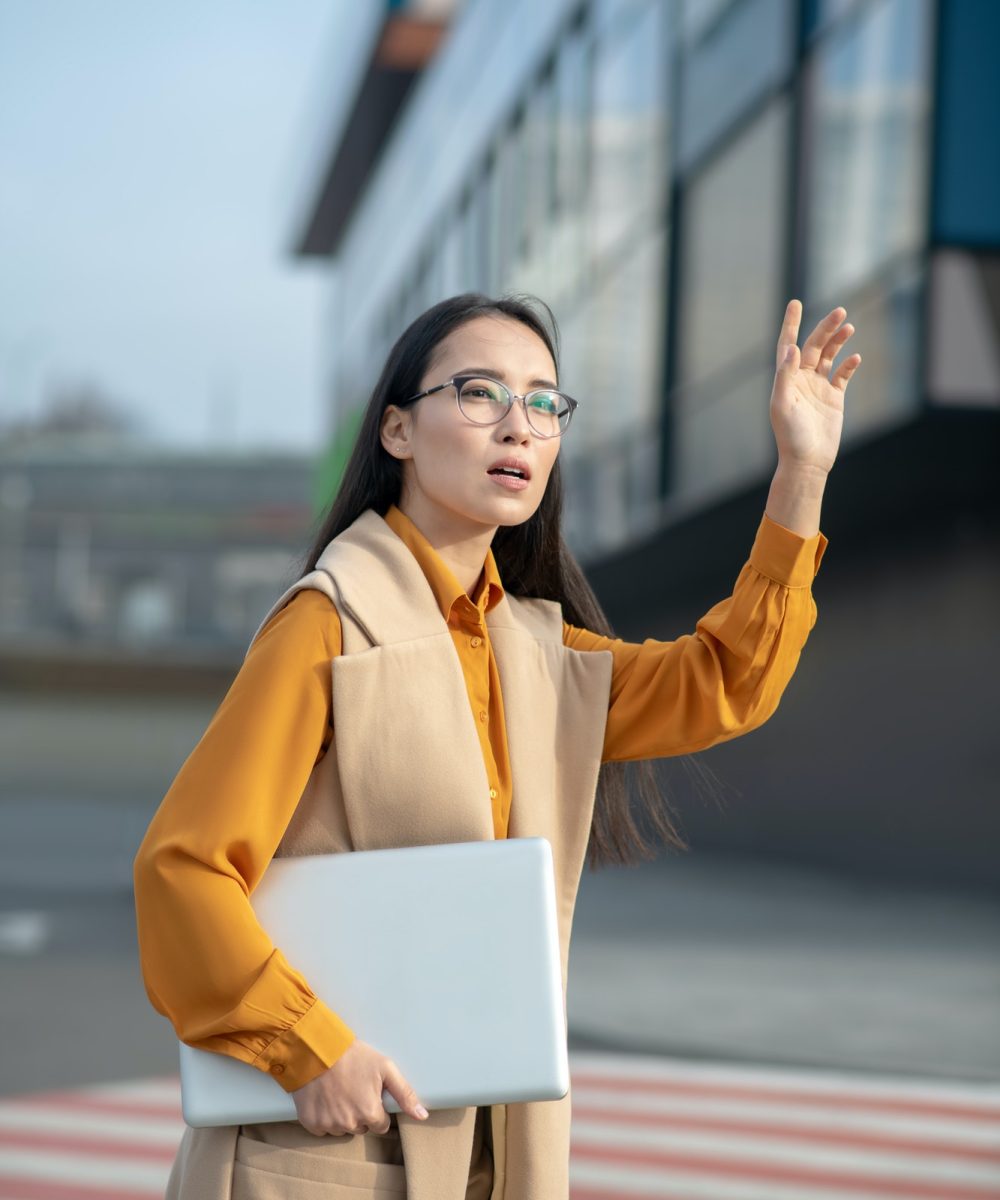young-asian-pretty-woman-waving-her-hand-on-the-road.jpg young-asian-pretty-woman-waving-her-hand-on-the-road.jpg